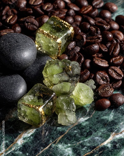 Green crystals, coffee beans, and stones
