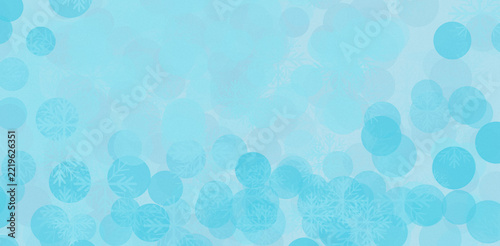 Light blue christmas background with soft bokeh circles and subtle