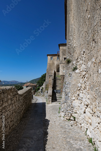 A narrow street winding between the old buildings of Montesarchio, a medieval town in southern Italy.
