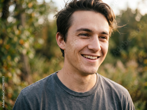 Portrait of Cheerful Young Man Smiling Outdoors Nature