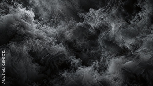 Dense layers of charcoal grey smoke swirling across a dark background, creating a mysterious cinematic atmosphere with rich textures, subtle highlights and dramatic smoky patterns for creative design.