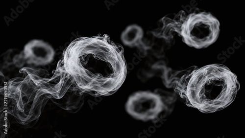 Several translucent white smoke rings floating at different depths against a pure black background, creating an atmospheric visual effect with soft focus and delicate vapor trails.