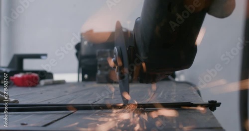 Close up shot of metal cutting process with power grinder disc and sparks