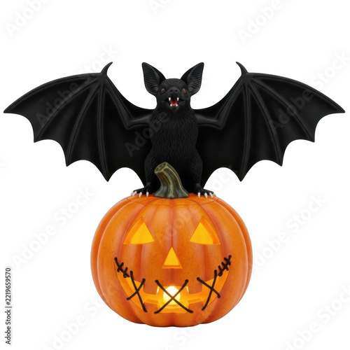 Halloween jack o lantern with bat decoration glowing inside