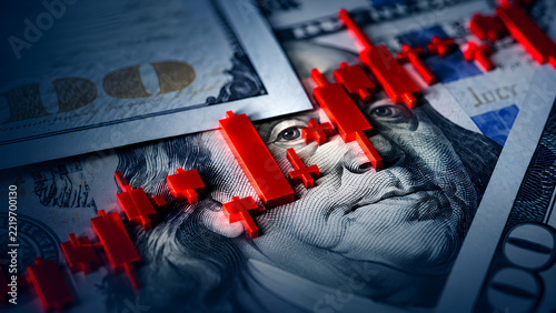 US dollar bills with red candlesticks symbolize market volatility and financial risk.