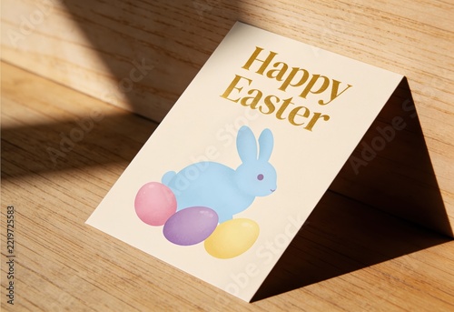 Happy Easter greeting card featuring cartoon rabbit with colorful eggs on wooden surface
