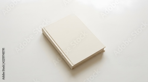 A high quality top view book mockup featuring a clean white hardcover book isolated on a simple plain background