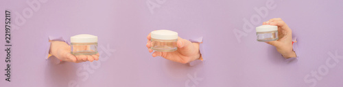 Hands holding empty cosmetic jars through purple background holes