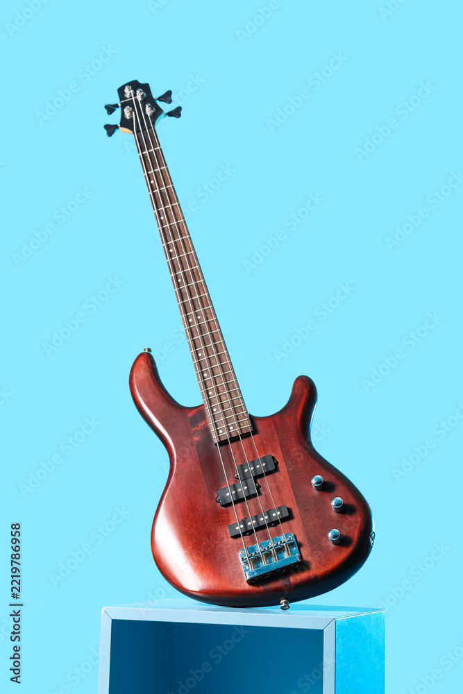 Fototapeta premium Music production and performance, electric bass guitar on a pedestal for recording studio sessions and live concert entertainment industry marketing