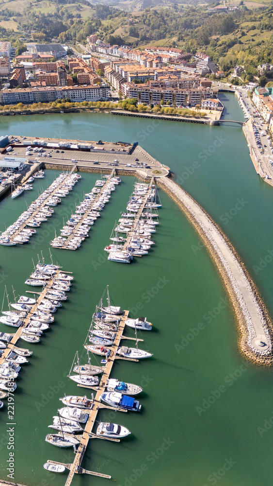 Fototapeta premium Zumaia marina aerial view with boats and town