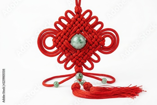 Traditional Chinese Red Knot with Green Jade Beads Isolated on White Background for Good Luck and Prosperity