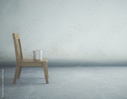 Hardship and scarcity represented by old metal mug on chair