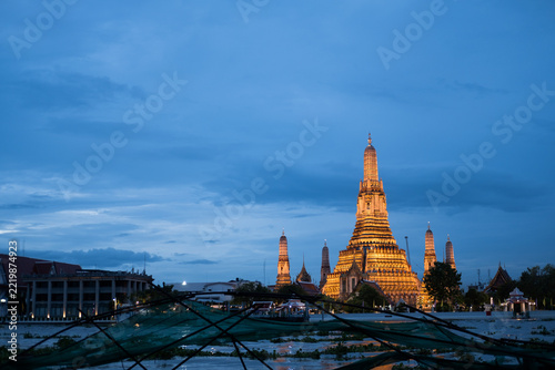 Wat Arun by Chao Phraya River at Bangkok, Thailand at twilight