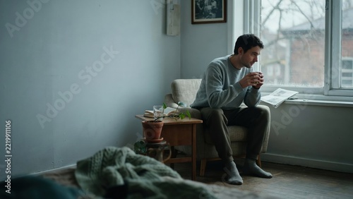 Man Sitting Alone by Window, Reflective Moment
