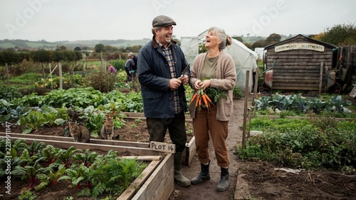 British Boomer Couple Laughing at Community Garden Allotment