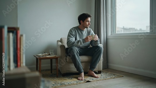 Man Sitting Alone by Window, Reflective Moment