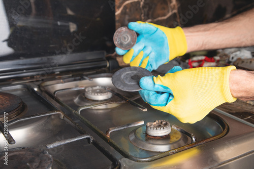 Caucasian master repairs of gas stove.