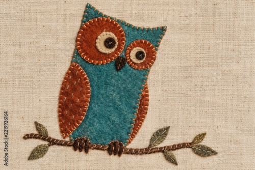 Simple vintage applique bird perched for the night