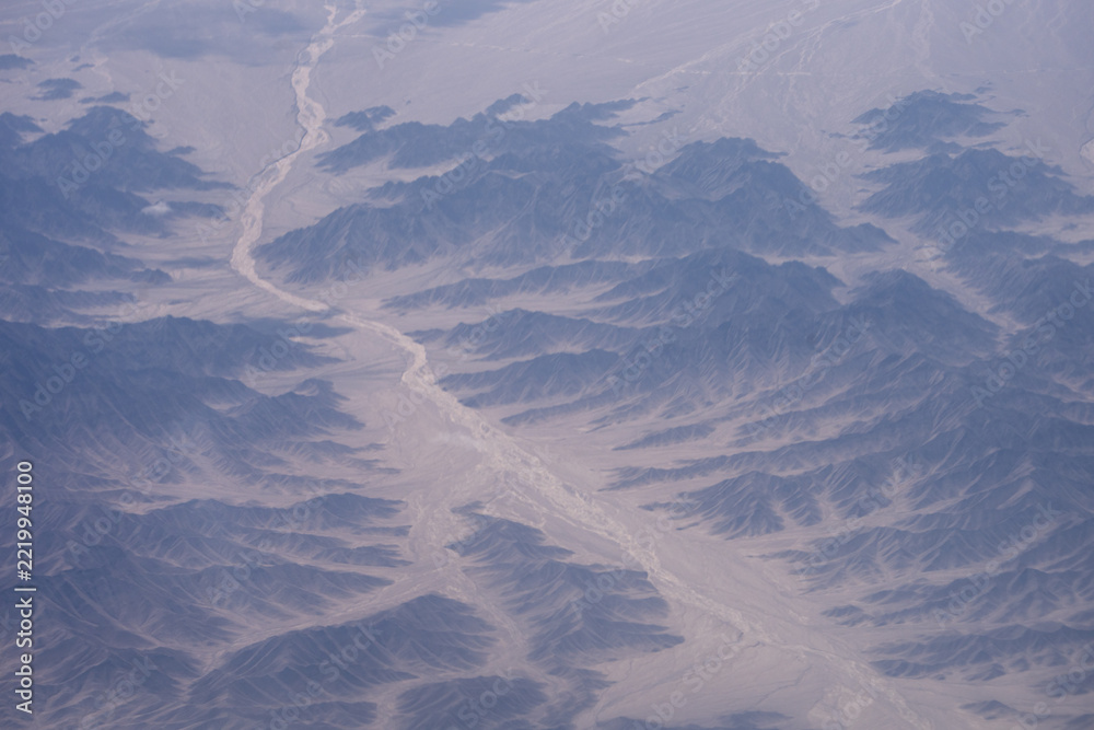 Fototapeta premium aerial view of arid canyon landscape in kash xinjiang