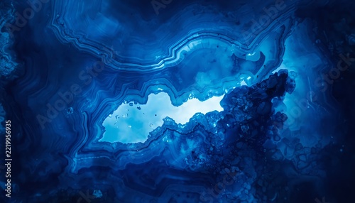 Deep blue agate stone slice backlit jewel mineral background