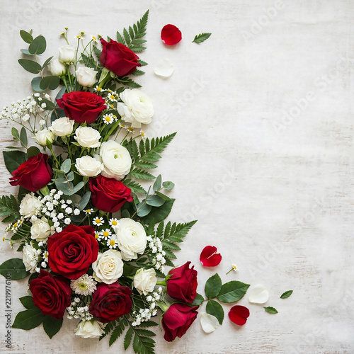 Elegant red and white roses bouquet with greenery for wedding table
