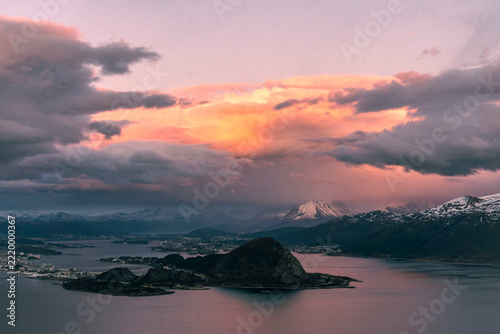 Ålesund town seen from Alnes, Town during the sunset, fjords, clouds and golden hour colors