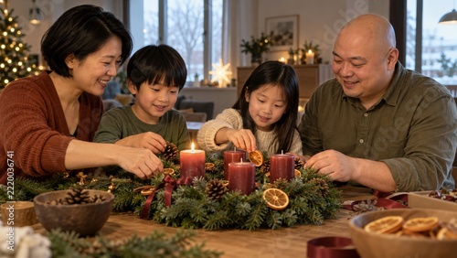 Family Decorating an Evergreen Advent Wreath Around a Cozy Home Table