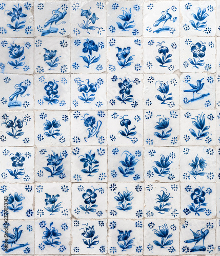 Obraz na plátně Traditional blue Portuguese floral azulejos, a form of Iberian painted tin-glazed ceramic tilework, in the historic town of Óbidos, Portugal