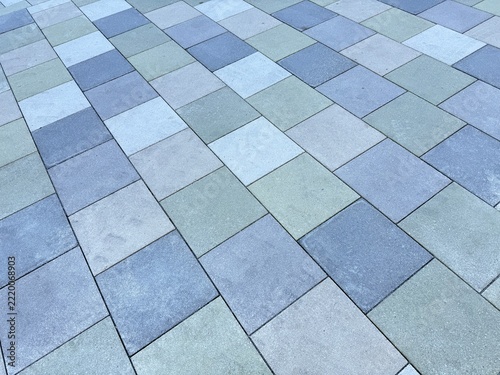Laying multicolored paving stones/concrete blocks in a gravel bed