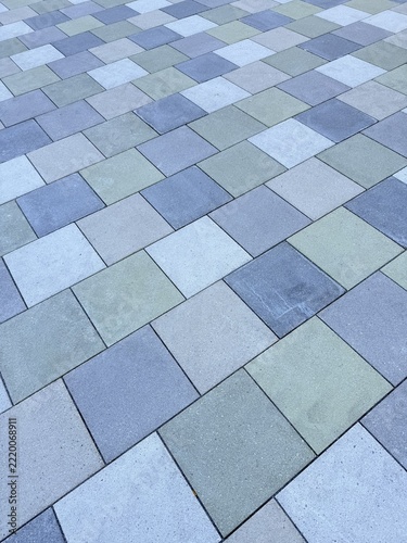 Laying multicolored paving stones/concrete blocks in a gravel bed