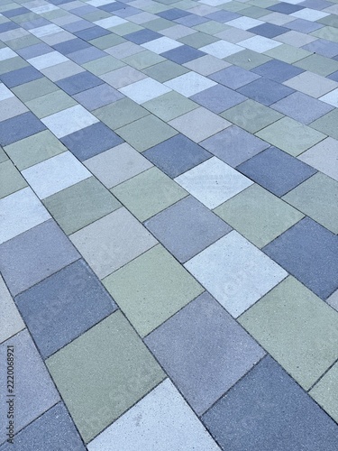 Laying multicolored paving stones/concrete blocks in a gravel bed