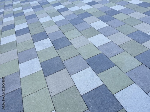 Laying multicolored paving stones/concrete blocks in a gravel bed