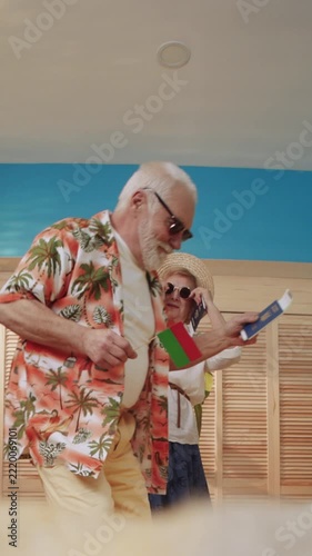 A Joyful Elderly Couple Dancing Together at a Vibrant Tropical Party Filled with Fun and Laughter