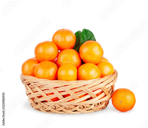 Fresh tangerine basket isolated on a white background, contour