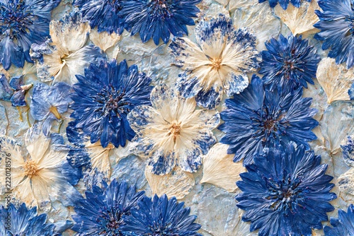 seamless pattern of Elegant blue and cream flowers with delicate petals in a textured floral painting, creating a romantic botanical background with vintage charm and artistic details.