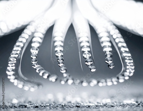 Abstract macro photography of beaded wire structure in monochrome