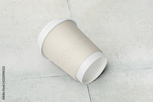 Blank paper cup on the ground