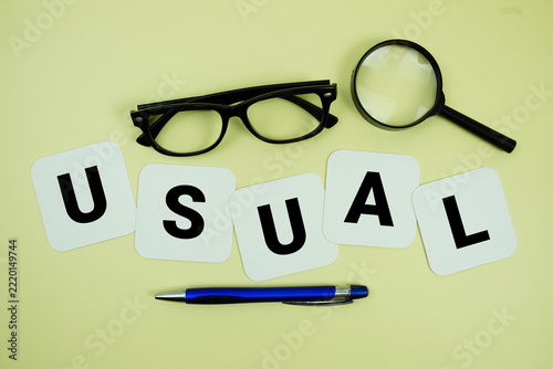 Obraz na plátně USUAL alphabet letters with magnifying glass, eye glasses and pen on yellow back