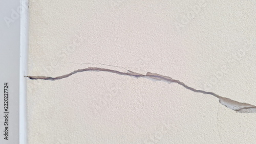 Cracked White Wall Surface Structural Damage Close-up