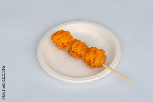 Battered chicken topped with sauce