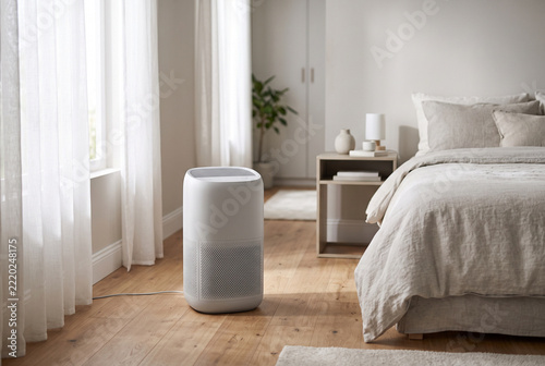 Compact air purifier in a bright restful bedroom