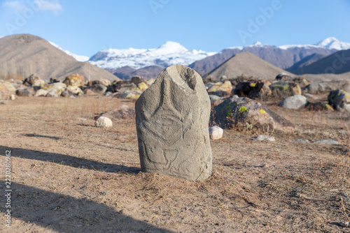 Fotografie Historical balbal stone stele with carved petroglyphs stands in the open air mus