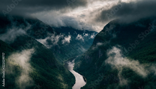 Dramatic misty mountain valley river landscape aerial nature scene