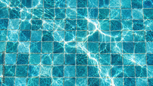 Turquoise Tiles Under Water with Rippling Sunlight