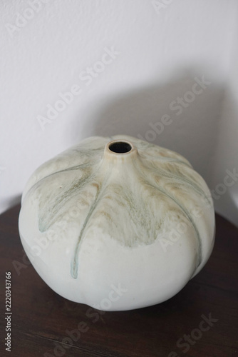 top view old white ceramic vase on a wooden floor, white cement wall background, object, decor, fashion, copy space