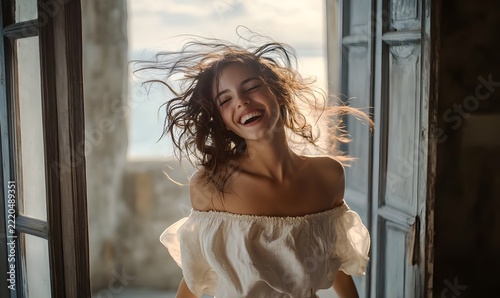 Joyful Woman Laughing by Open Window