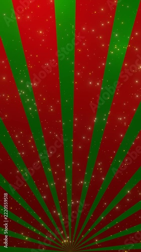 Slowly Rotating Red and Green Christmas Sunburst with Golden Sparkling Particles, Festive Vertical Background Loop