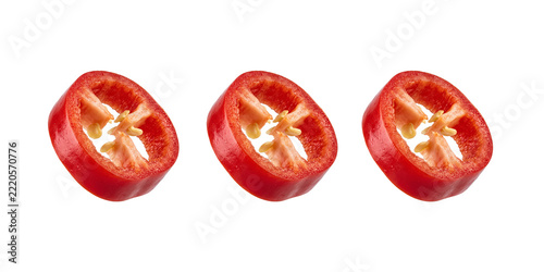 Three sliced red chili pepper rings with seeds isolated on transparent background
