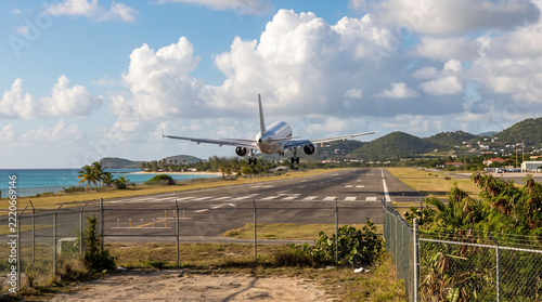 Jet Aircraft Taking Off Against a Tropical Mountain Landscape