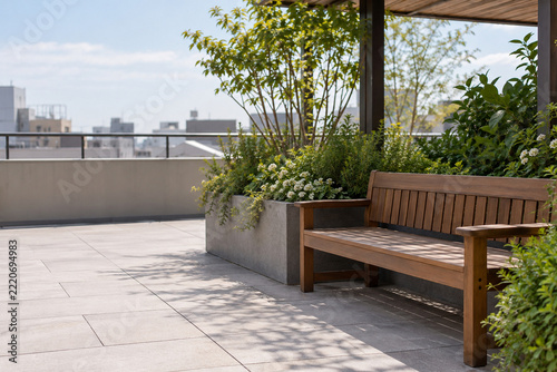 Wooden bench in a green rooftop garden overlooking the city